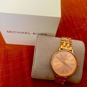 Women’s Micheal Kors rose gold watch